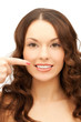 woman pointing at her toothy smile