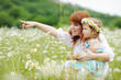 happy family in daisy field