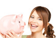 Photo: lovely girl with big piggy bank lovely girl with big piggy bank