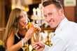 Photo: happy couple in restaurant eat fast food happy couple in restaurant eat fast food