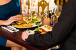 Photo: happy couple have a romantic date in restaurant happy couple have a romantic date in restaurant
