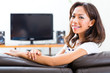 Young asian woman at home on the sofa