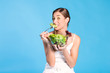 Healthy nutrition - young woman with salad