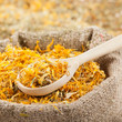sack of healing herbs and wooden scoop, herbal medicine