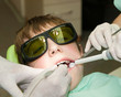 Young boy during drilling tooth