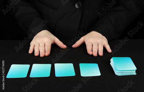 Photo: Hand with business cards. Concept: Business like poker game. Hand with business cards. Concept: Business like poker game.