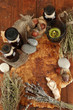 Composition with old papers, herbs, stones and bottles with
