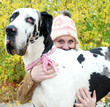 Young Woman smiling behind her Dog