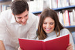 Friends reading a book