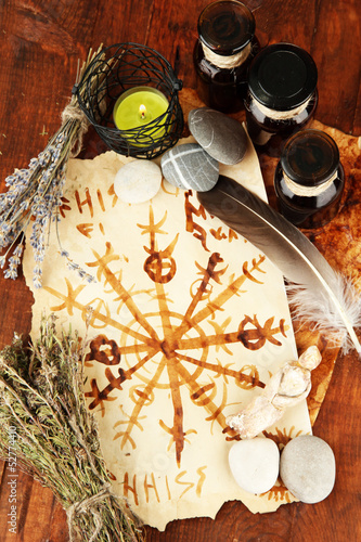 Photo: Composition with old papers, herbs, stones and bottles with Composition with old papers, herbs, stones and bottles with