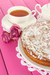 Photo: Delicious poppy seed cake with cup of tea on table close-up Delicious poppy seed cake with cup of tea on table close-up