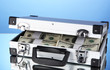 Suitcase with 100 dollar bills on blue background