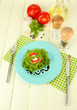 Tasty roasted marrow and tomato slices with salad leaves,