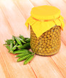 Green peas on wooden background