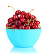 Ripe red cherry berries in bowl isolated on white