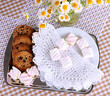 Cookies and marshmallow on table on checkered tablecloth
