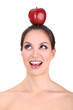 Photo: Smiling woman with apple isolated on white Smiling woman with apple isolated on white