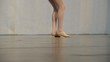 Young ballerina dancing, close up on legs and shoes
