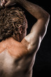 Ancient warrior covered in mud, back