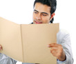 A male doctor sitting at the desk on white background