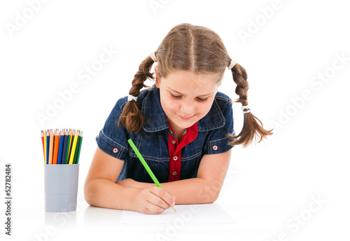 Photo: Cute child draw with colorful crayons, isolated over white Cute child draw with colorful crayons, isolated over white