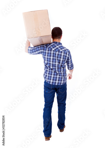 Photo: Young man carrying a card box, isolated on white Young man carrying a card box, isolated on white