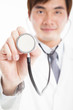 Photo: young smiling Doctor with stethoscope young smiling Doctor with stethoscope