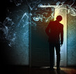 Young businessman opening door