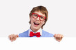 Photo: Boy in red glasses holding white square Boy in red glasses holding white square