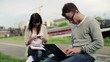 Video: Young students with laptop and smartphone in the city Young students with laptop and smartphone in the city