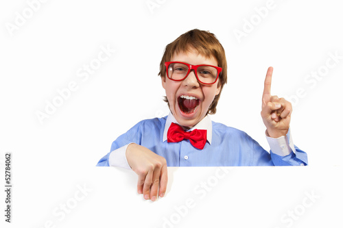 Photo: Boy in red glasses holding white square Boy in red glasses holding white square