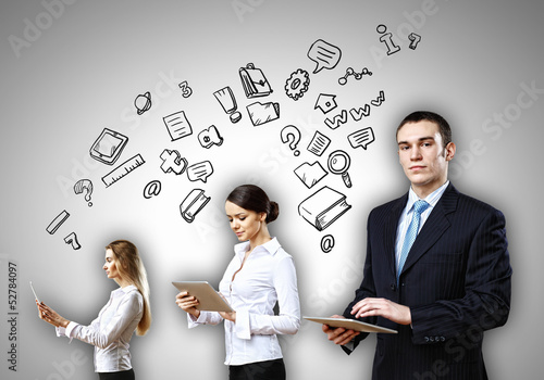 Photo: Three young people in business suits Three young people in business suits
