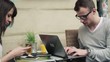 Video: Young students with smartphone and laptop in cafe Young students with smartphone and laptop in cafe