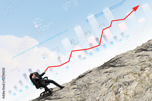 Photo: Businessman pulling graph Businessman pulling graph