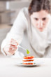 Cook serving tomato and mozzarella slices