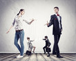 Businesspeople with marionettes