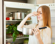 Long-haired woman  holding foul food