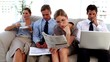 Video: Business people sitting on a couch Business people sitting on a couch