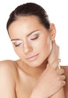 A Young Woman Touching Her Fac...