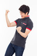 Young Asian man showing fist and happy sign.