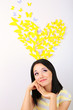 Girl near paper butterflies fly on wall