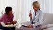 Woman sitting on sofa talking to therapist