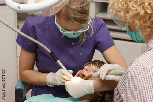 Photo: Dentist working Dentist working
