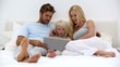Parents and daughter using laptop together