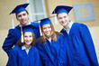 Friends in graduation gowns