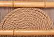 Foto: background of marine rope, bamboo sticks and wood background of marine rope, bamboo sticks and wood