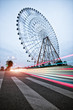 Night, a rotating Ferris wheel.