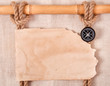 Foto: Compass, knot and old paper on the background of old cloth Compass, knot and old paper on the background of old cloth