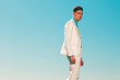 Vintage summer fifties fashion man wearing white suit and tie. O