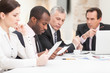 Multi ethnic business people discussing work